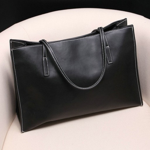 ショッピングのための黒と白の本革のハンドバッグ
